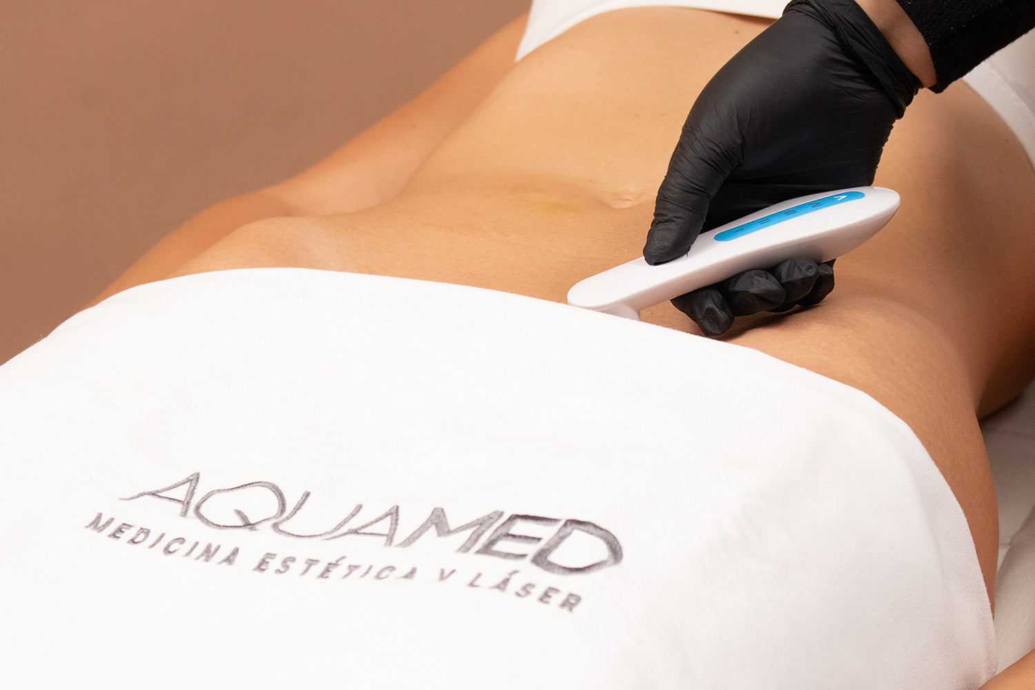 A woman receiving laser hair removal on her bikini line.