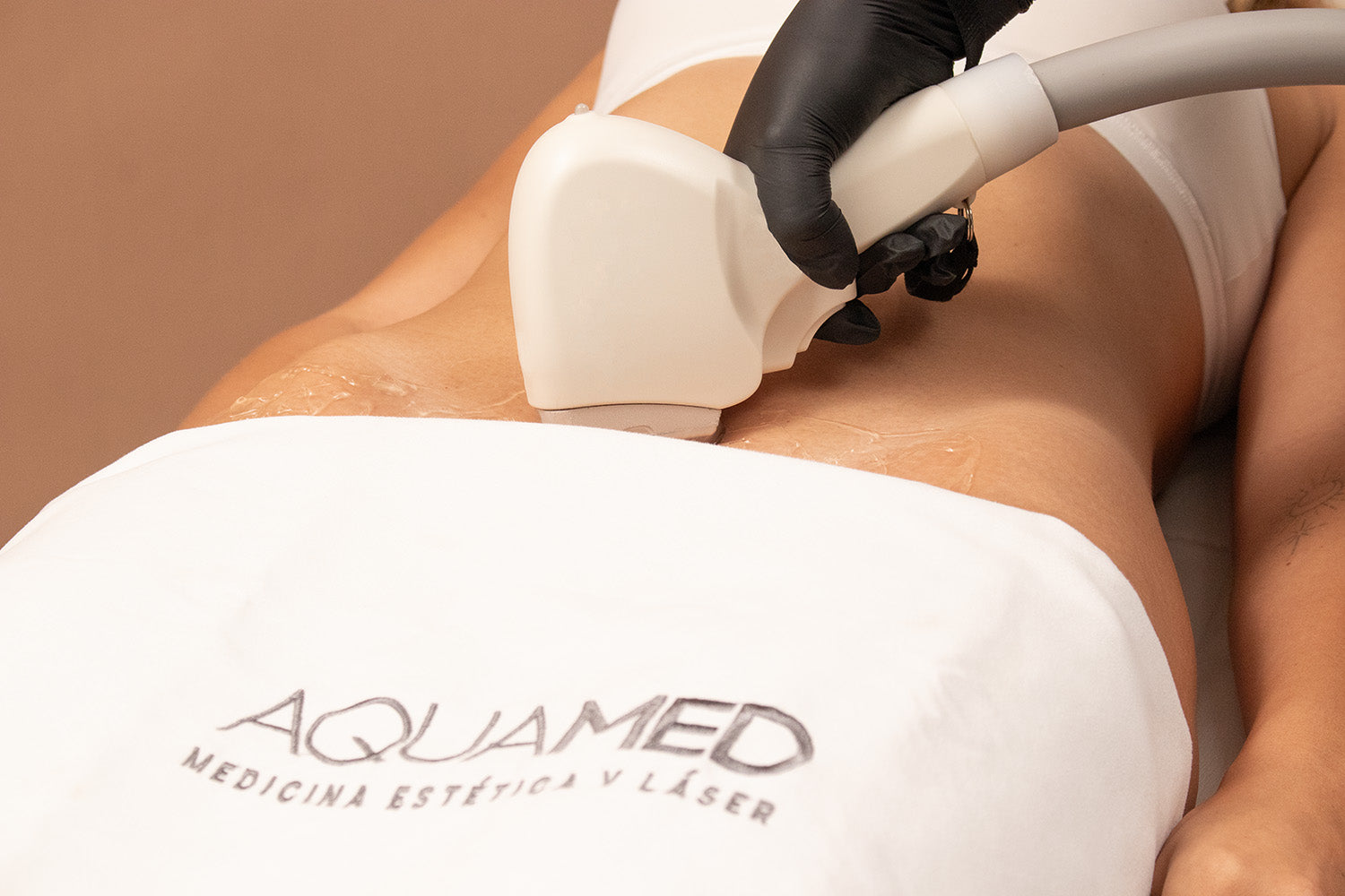 A woman receiving laser hair removal on her bikini line.