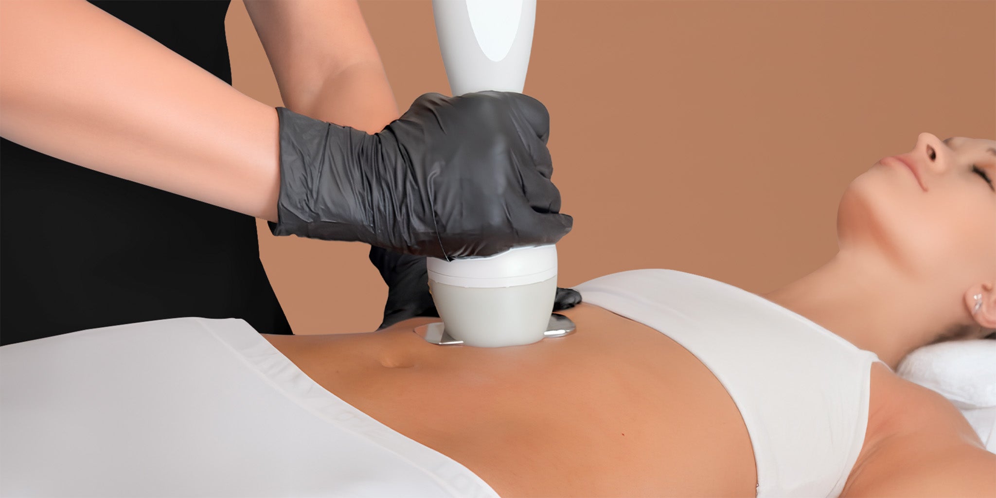 A woman's abdomen receiving a cosmetic treatment. 